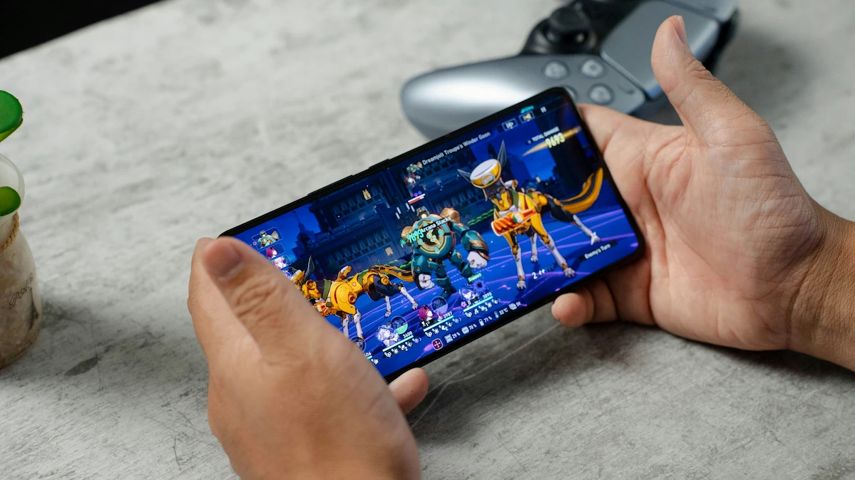 A person playing a game on their smartphone
