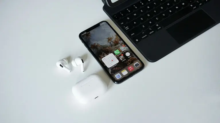 smart phone, laptop, and ear buds